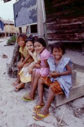 Between dives,burma, sea gypsies kids on school steps. by Allen Ayling 